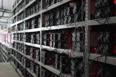 A mining farm with rows of servers humming with activity, illustrating the importance of a reliable and secure hosting facility.